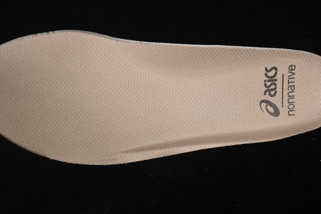Close-up of the beige insole with ASICS and nonnative branding.