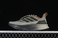 Side profile of olive and gray adidas Ultraboost 5 Climawarm shoes with dark stripes and orange accents