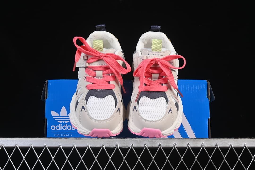 Front view of the pair displayed on an Adidas box.