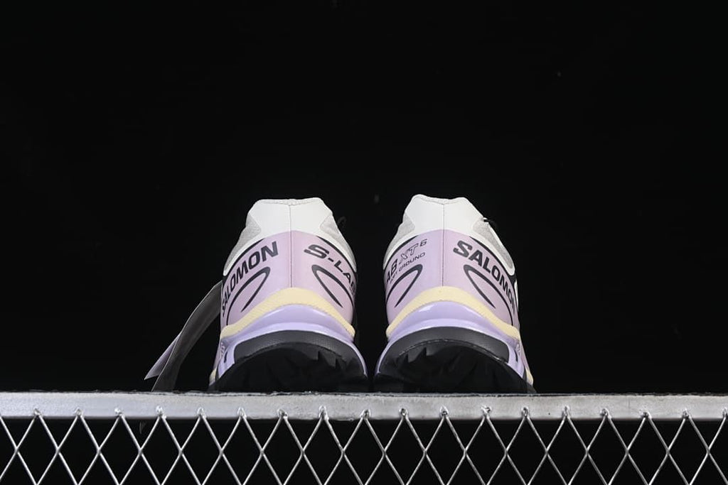 Rear view of the pair showing heel graphics and outsole edges