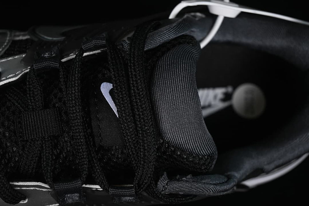 Close-up of black laces, tongue, and padded collar