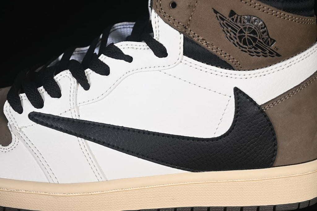 Close-up of the black reversed Swoosh and brown ankle panel