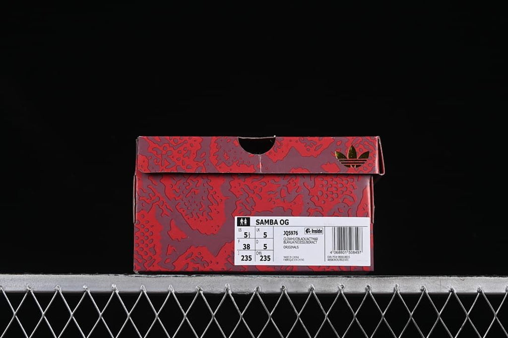 Red patterned shoe box with a visible Samba OG product label