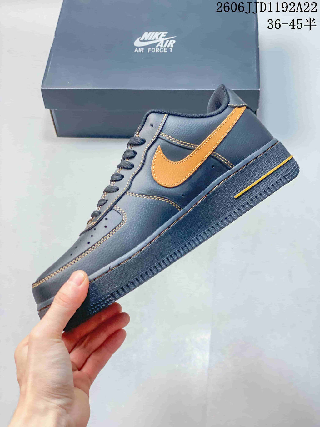 Side view of a blue low-top sneaker with orange Swoosh and contrast stitching