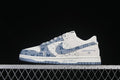 Side view of a white and blue low-top sneaker with denim-style panels and visible Louis Vuitton branding