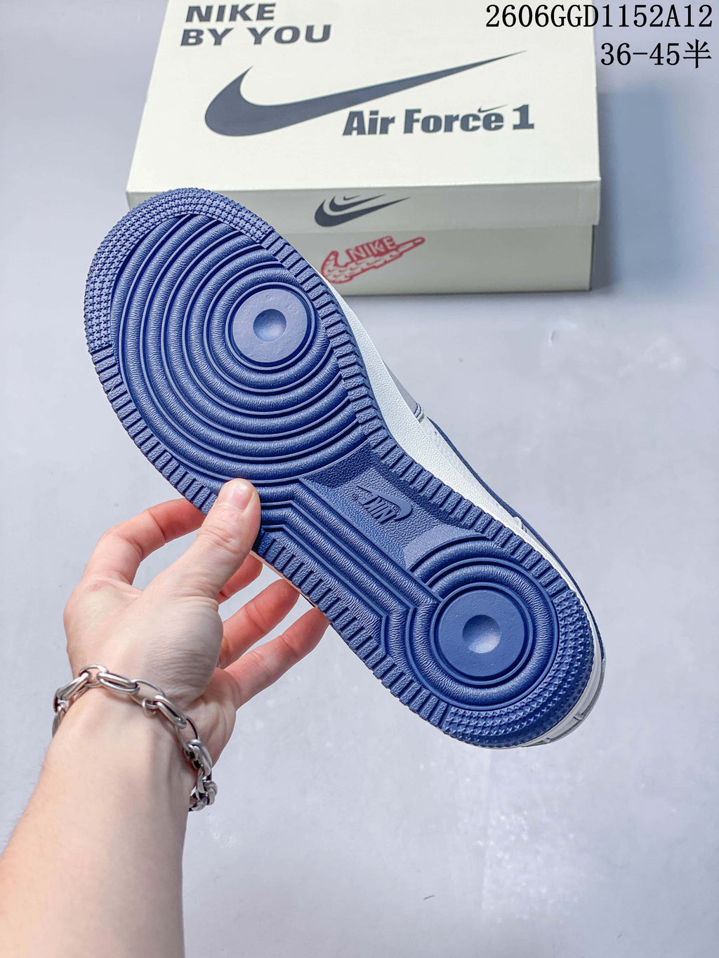 Close view of the navy blue outsole on the Nike Air Force 1 sneaker