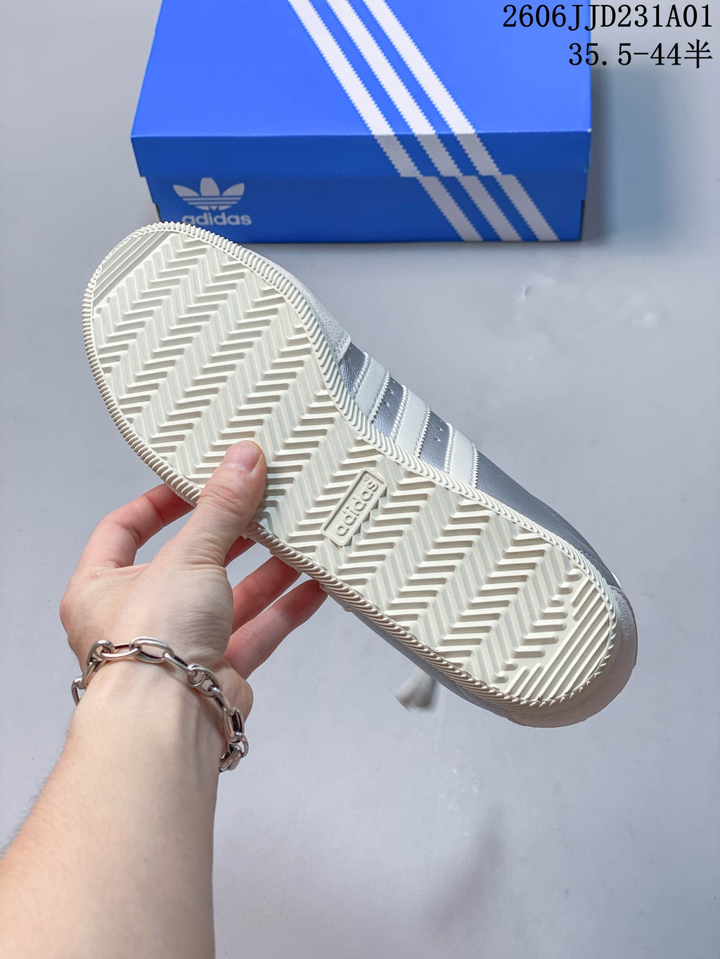 Close-up of the sneaker outsole showing a herringbone-style tread