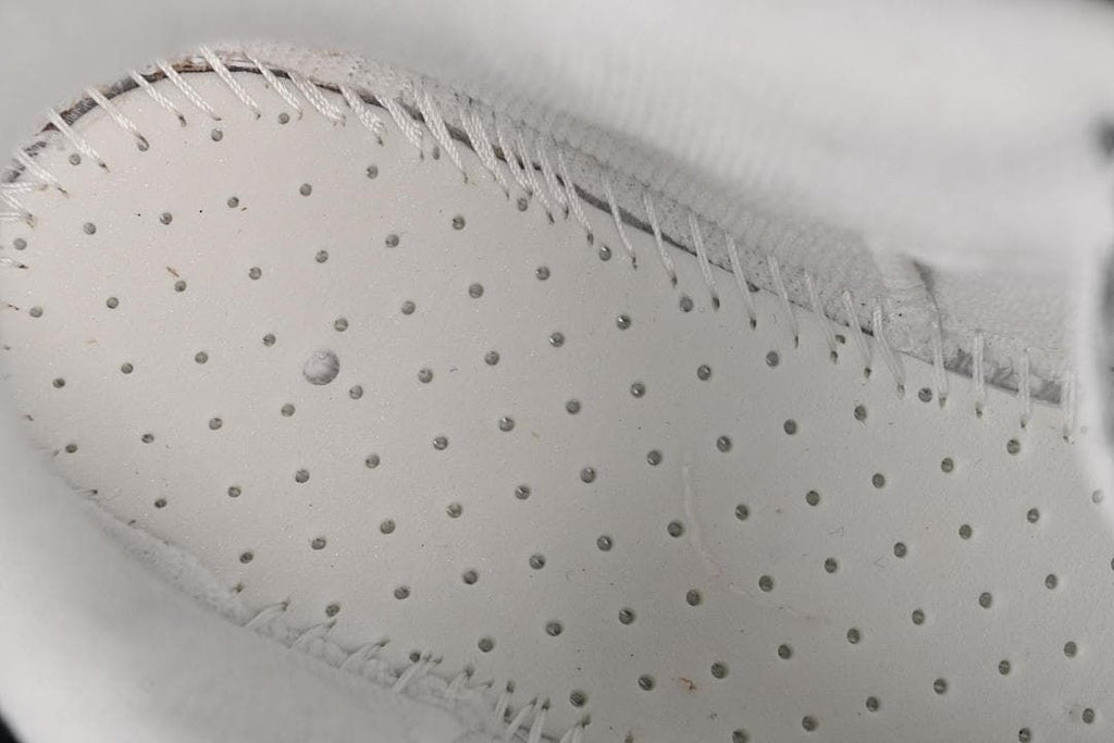 Close-up of perforated interior construction and stitching
