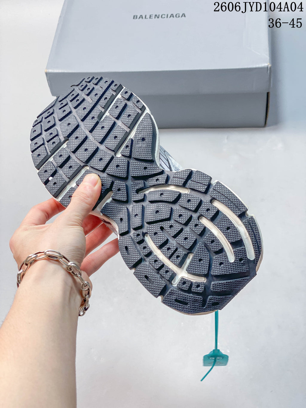 Close-up of the sneaker outsole with a segmented tread pattern