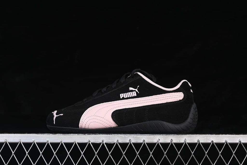 Side profile of the Puma Speedcat OG in black and pale pink.