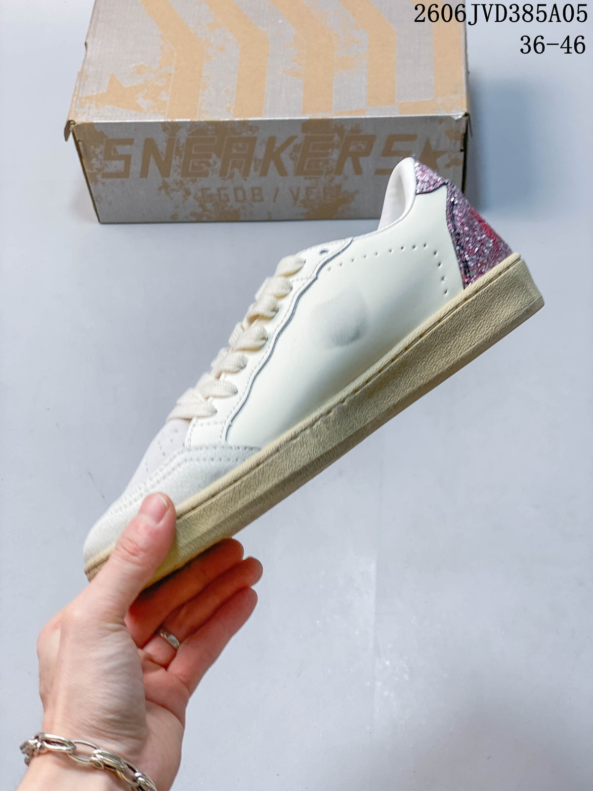Side profile showing the white upper, perforations and glittery heel panel.