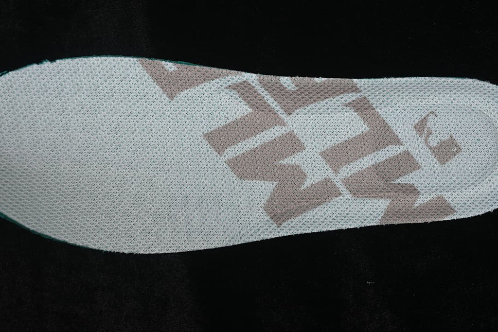 Close-up of the white insole with a beige graphic