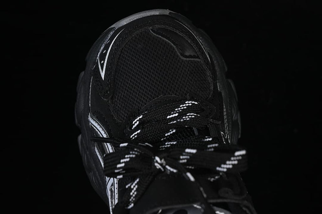 Top view of the sneaker showing the mesh-like vamp and patterned laces.