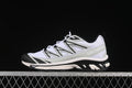 Side view of white, gray, and black Salomon XT-6 Expanse sneakers.