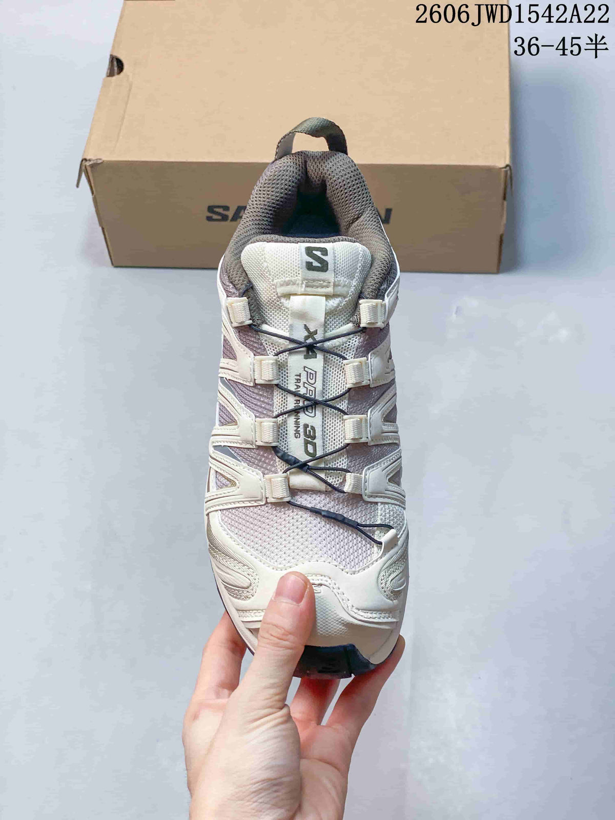 Top view showing the sneaker's cord-style lacing and mesh-like upper