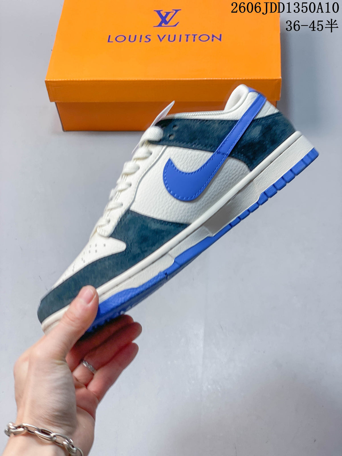 Side view showing the blue Swoosh and contrasting overlays on a low-top sneaker