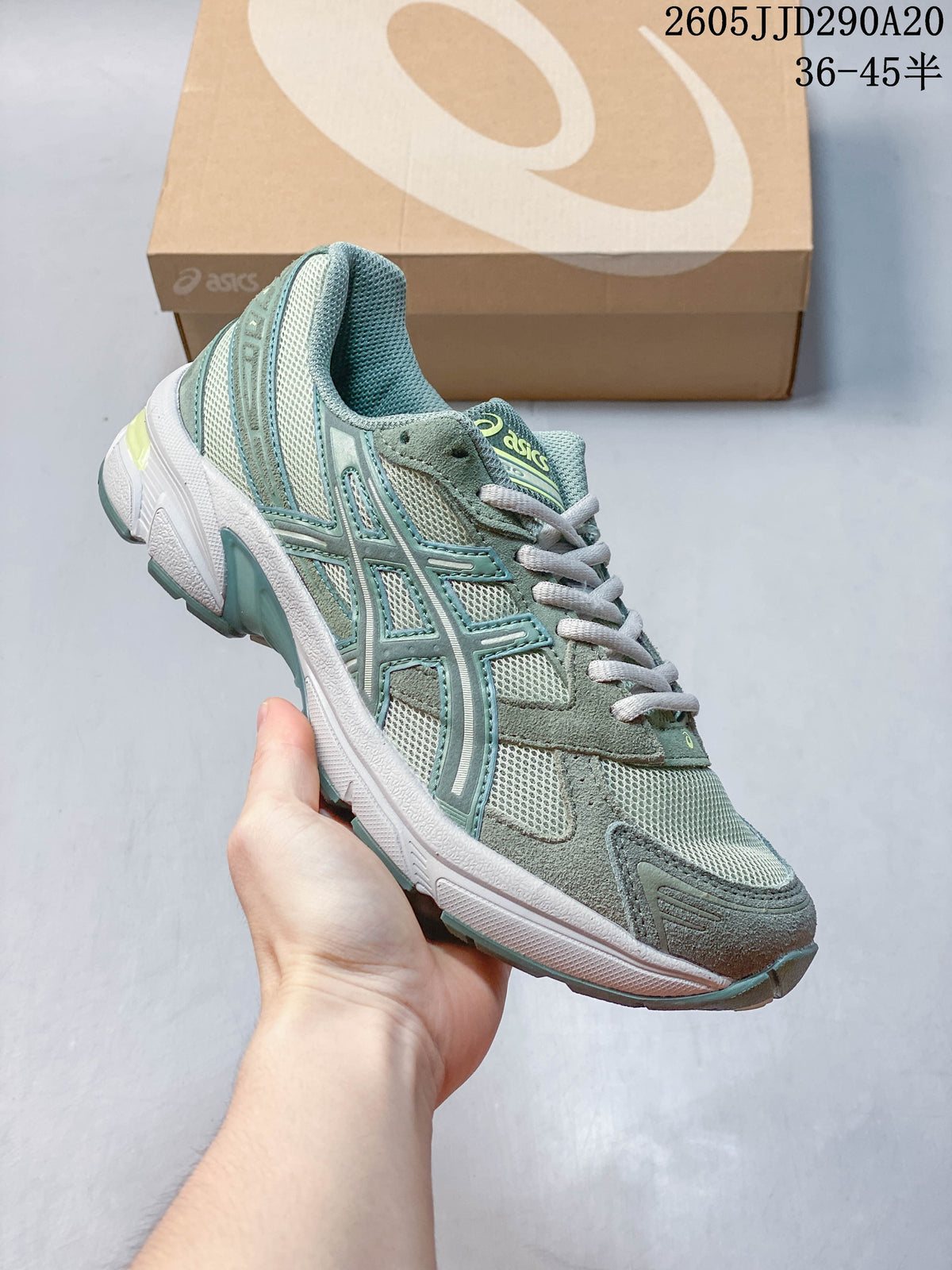 Angled side view of a sage-green ASICS GEL-1130 sneaker