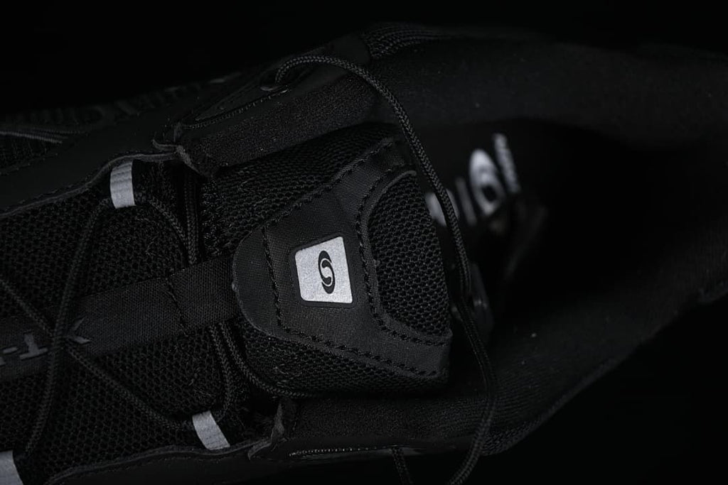 Close-up of the tongue, lace, and mesh-like panels