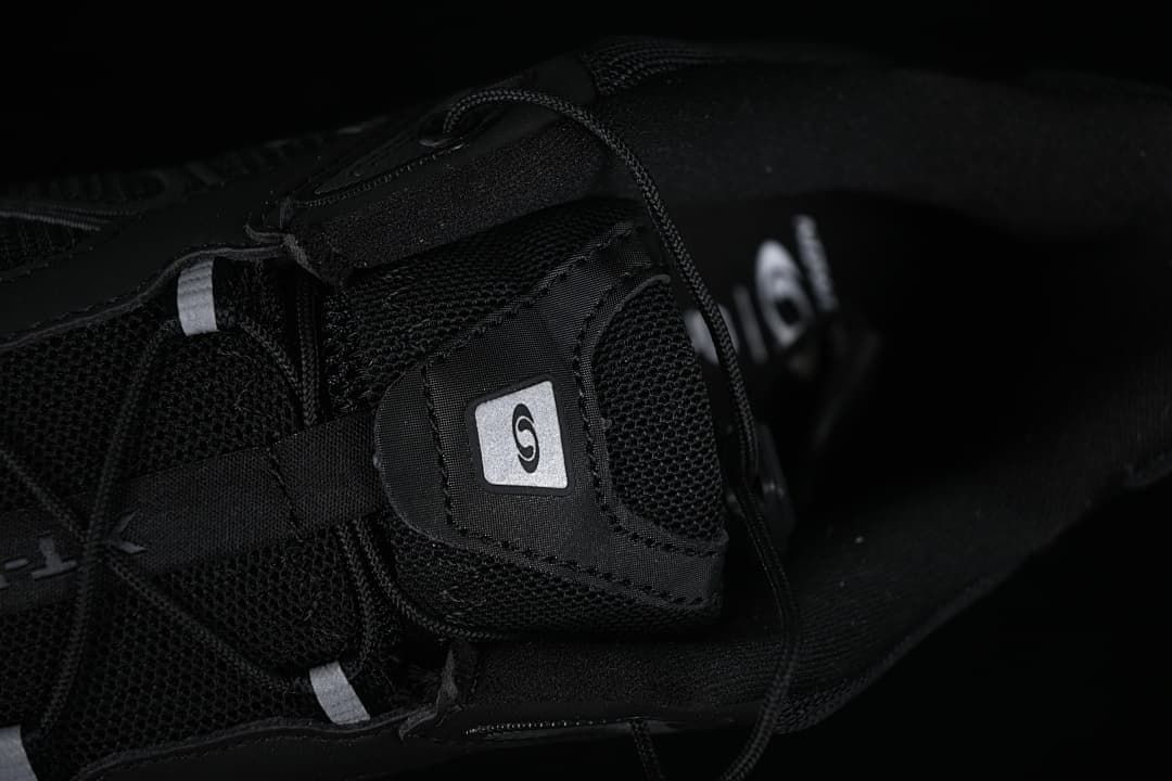 Close-up of the tongue, lace, and mesh-like panels