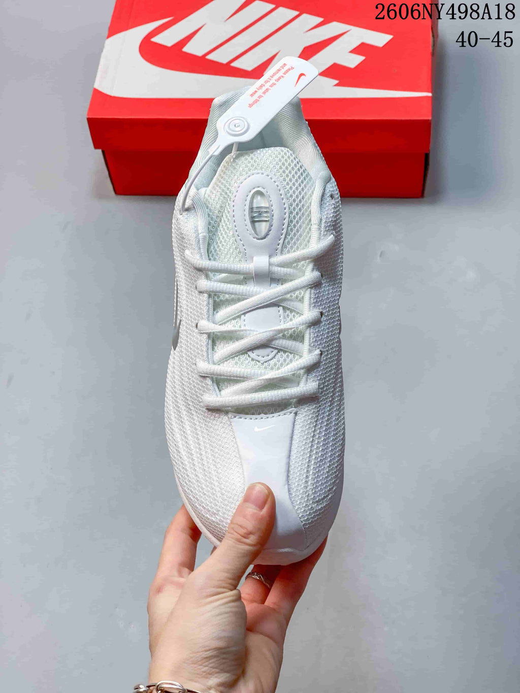 Top view of a white lace-up sneaker with textured upper