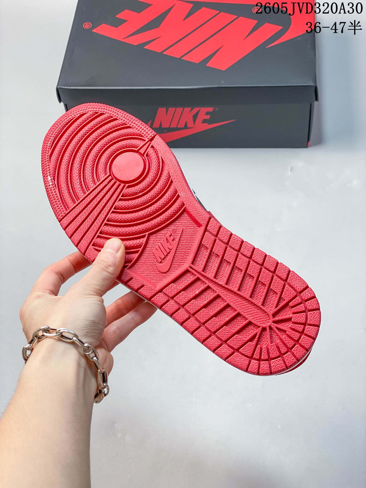 Red outsole with circular tread pattern