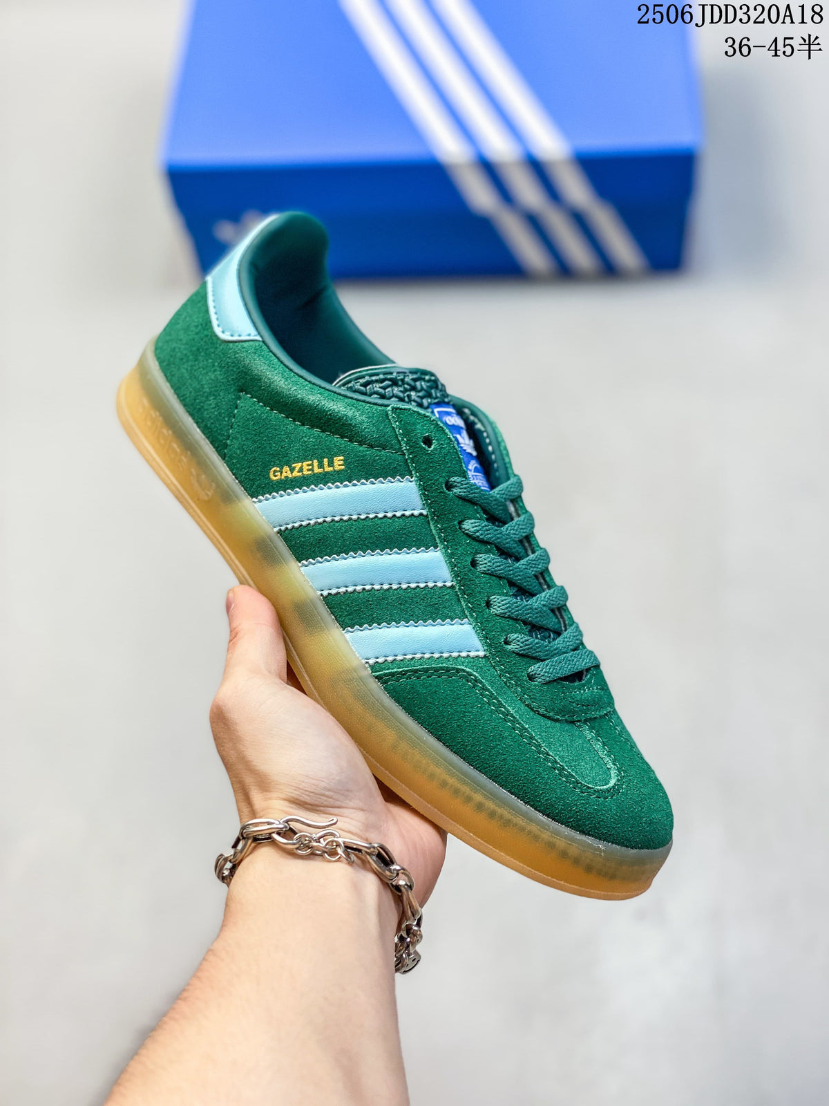 Green Adidas Gazelle low-top sneaker with pale blue stripes