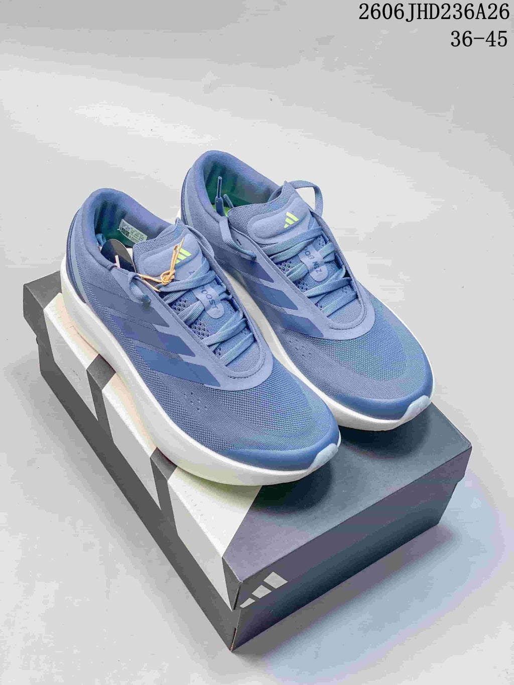 Blue adidas ZENBOOST low-top shoes with a contrasting white sole.