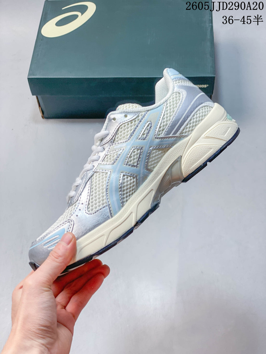 Side view of the ASICS GEL-1130 sneaker with mesh panels and layered overlays