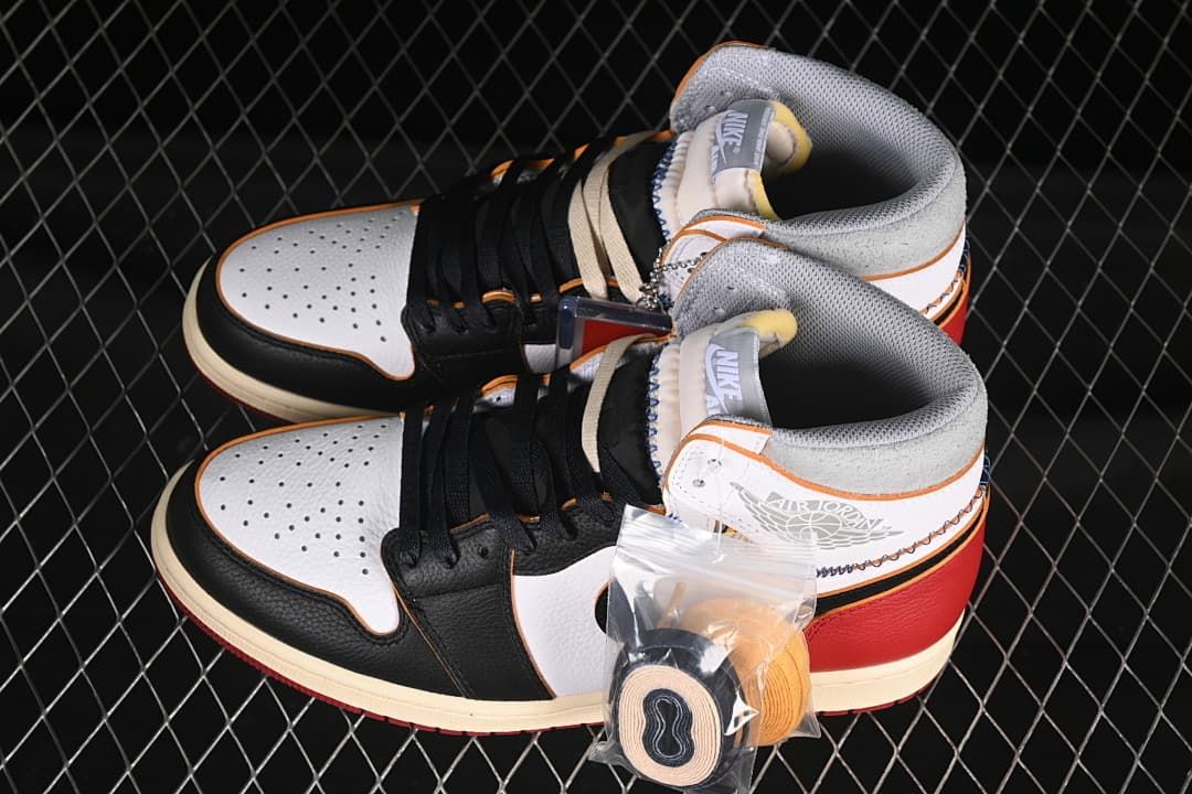 Pair of high-top sneakers with extra laces pictured in front