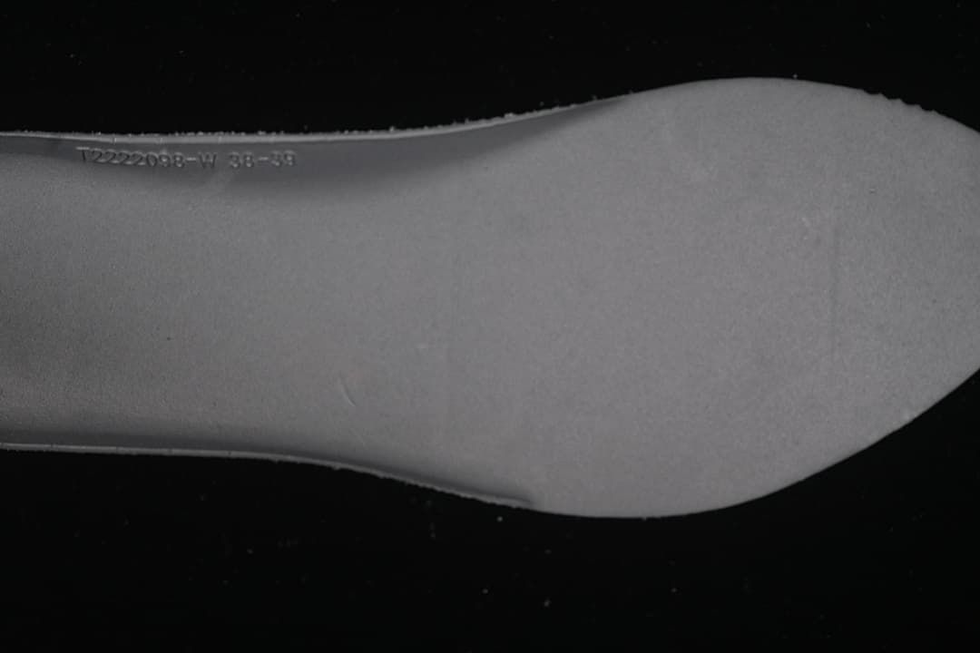 Close-up of an insole with a faint size marking