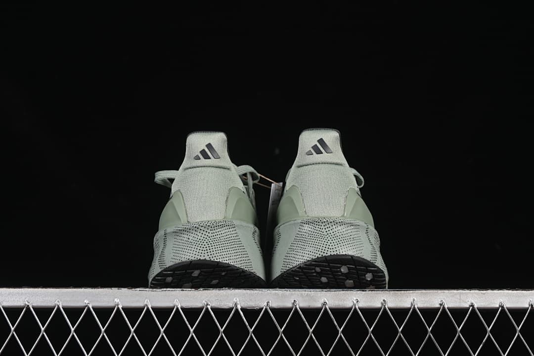 Rear view of the pair showing heel tabs and outsole edges