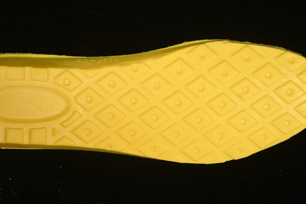 Yellow shoe insert shown from underneath