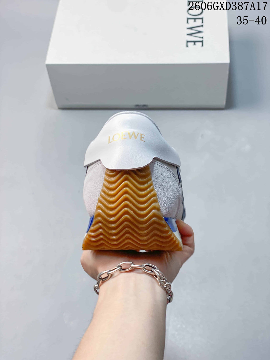 Rear view showing the sneaker heel and gum outsole