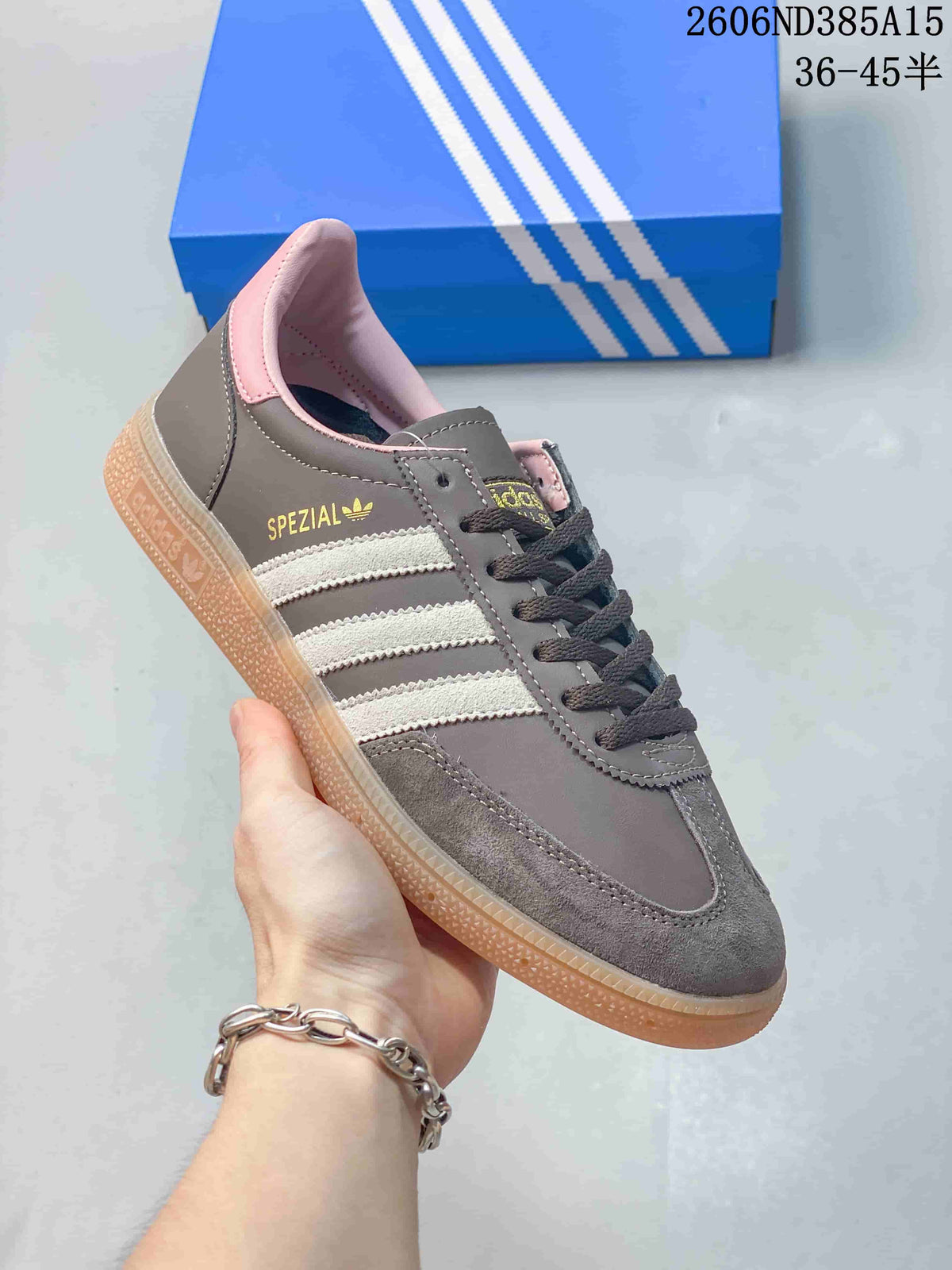 Angled side view of the sneaker showing its grey upper, white stripes and visible Spezial marking.