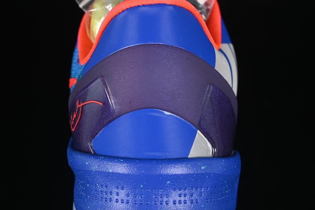 Rear view of blue and purple heel with orange signature detail