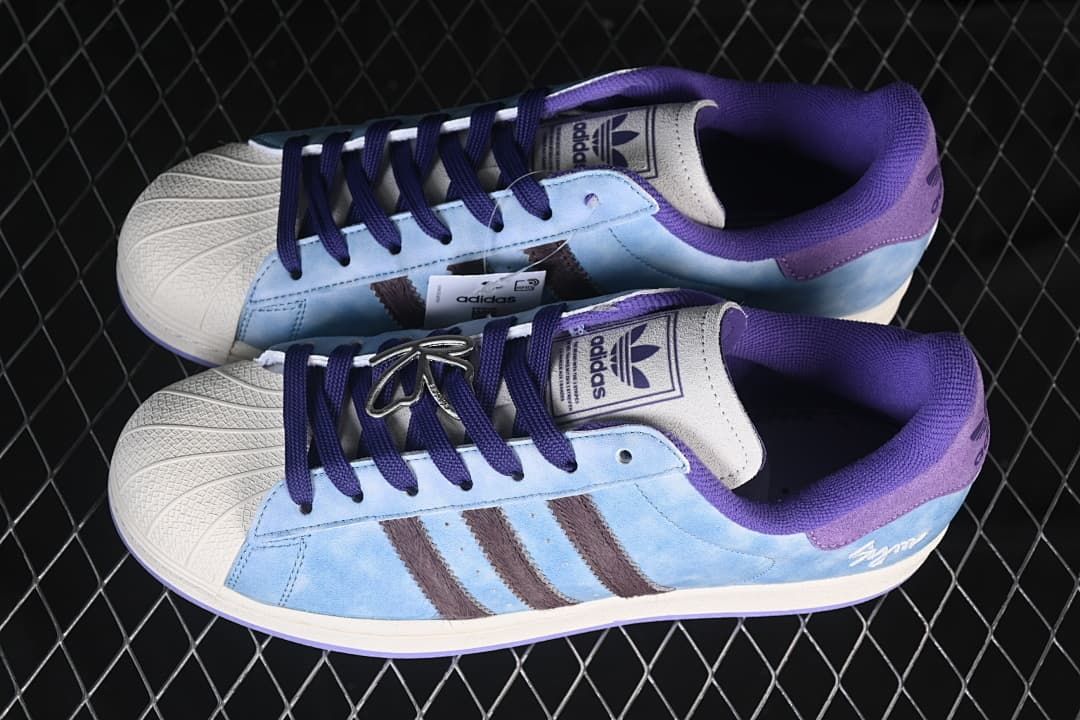Pair of light blue and purple Superstar II sneakers shown from above