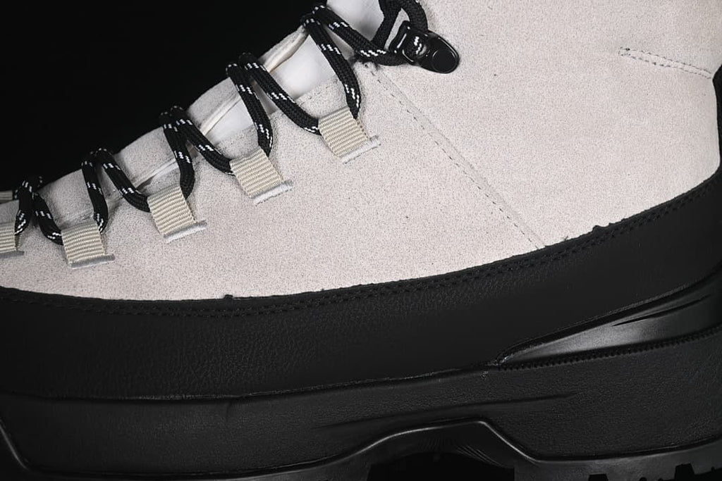 Close-up of the boot's lace loops, laces, side wrap, and sole