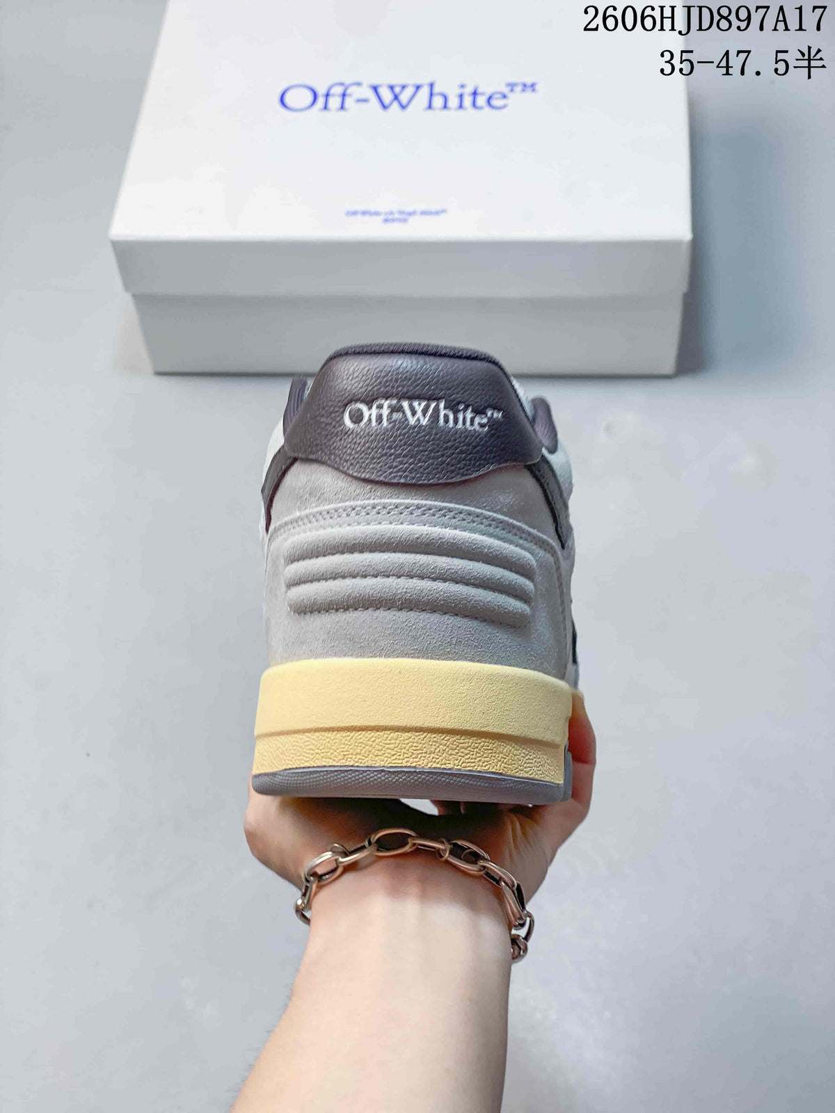 Rear view of the sneaker with a dark heel tab and pale yellow midsole accent