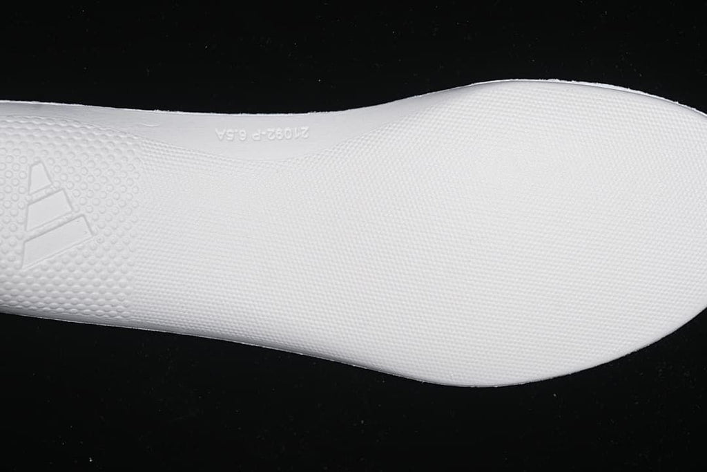 Close-up of the white textured midsole outsole surface