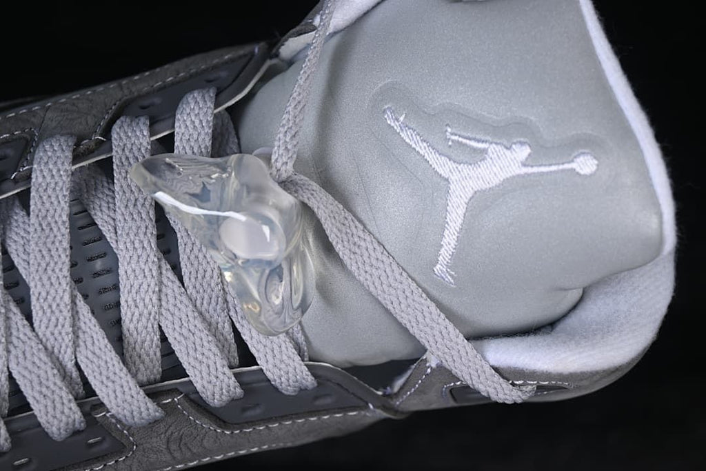 Close-up of tongue logo, laces and lace toggle