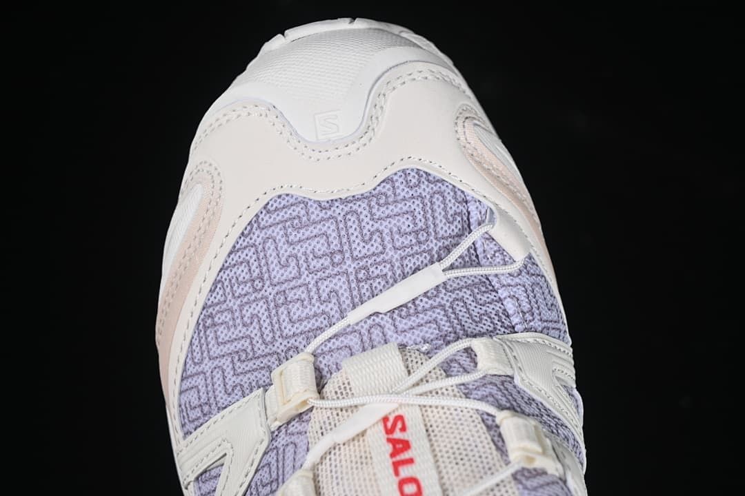 Close-up of the shoe's patterned toe area and front overlays.