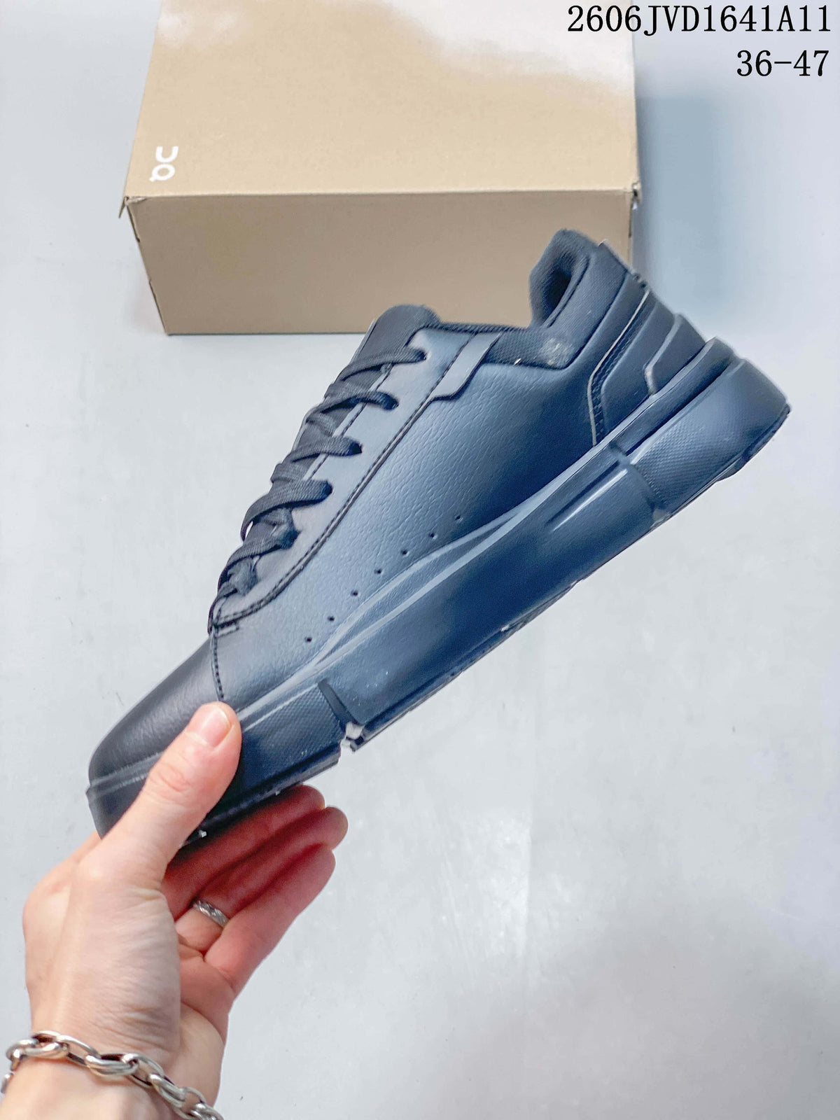 Side profile of a slate-blue low-top sneaker with perforated panels