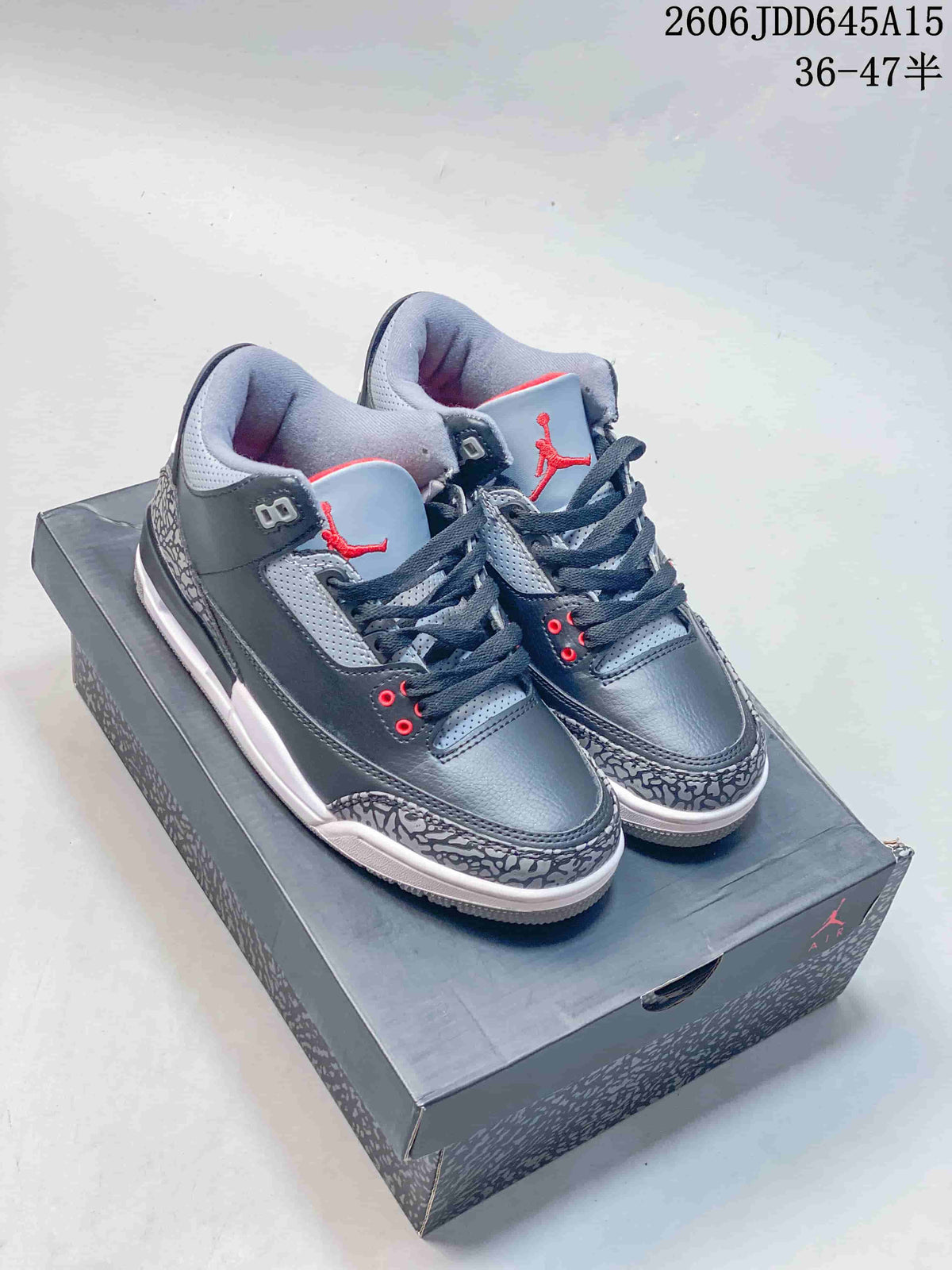 Pair of grey Air Jordan 3 Retro sneakers with red accents and elephant-print overlays, displayed on a shoebox.