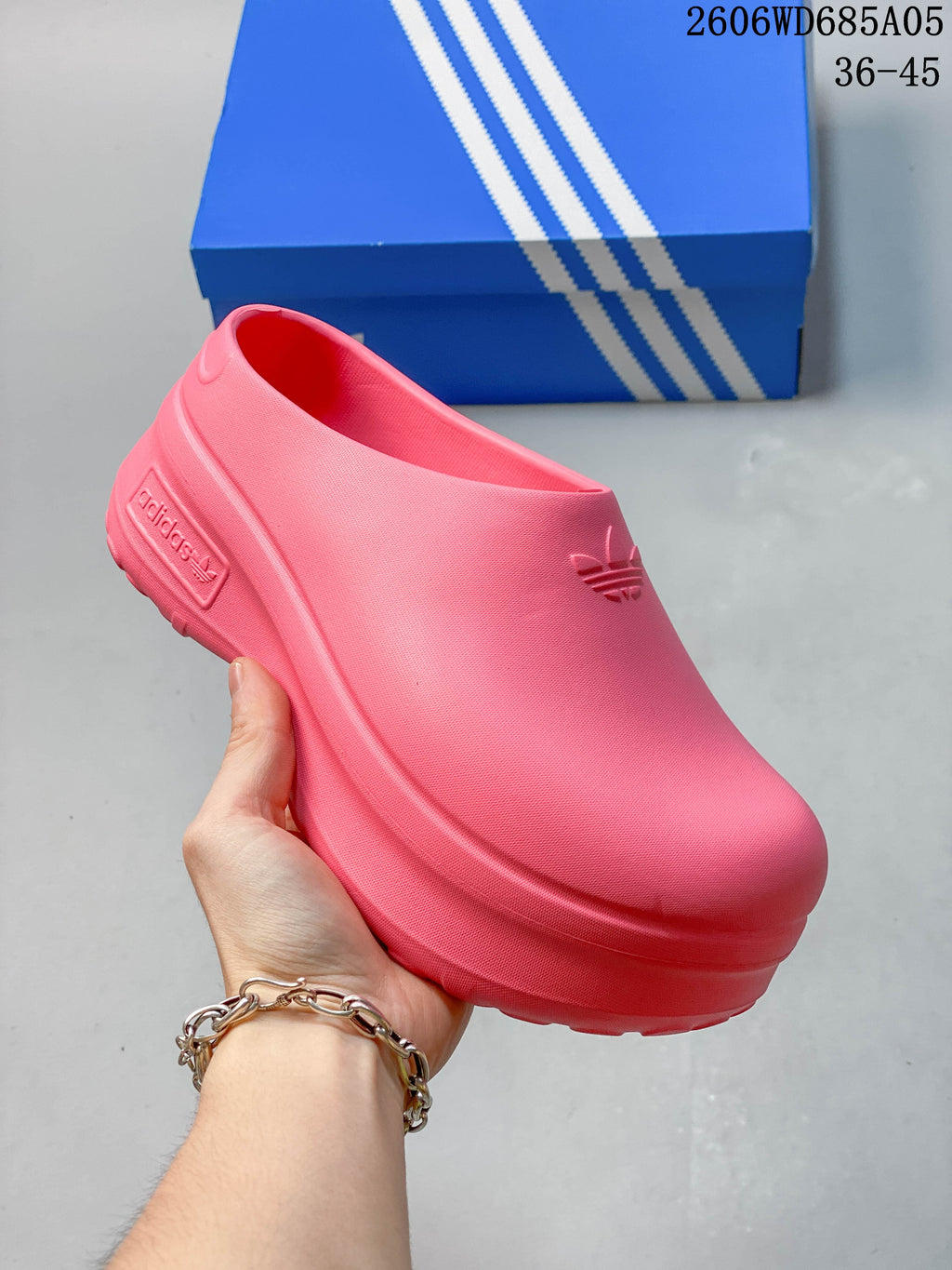 Light pink Adidas mule clog with a raised platform sole
