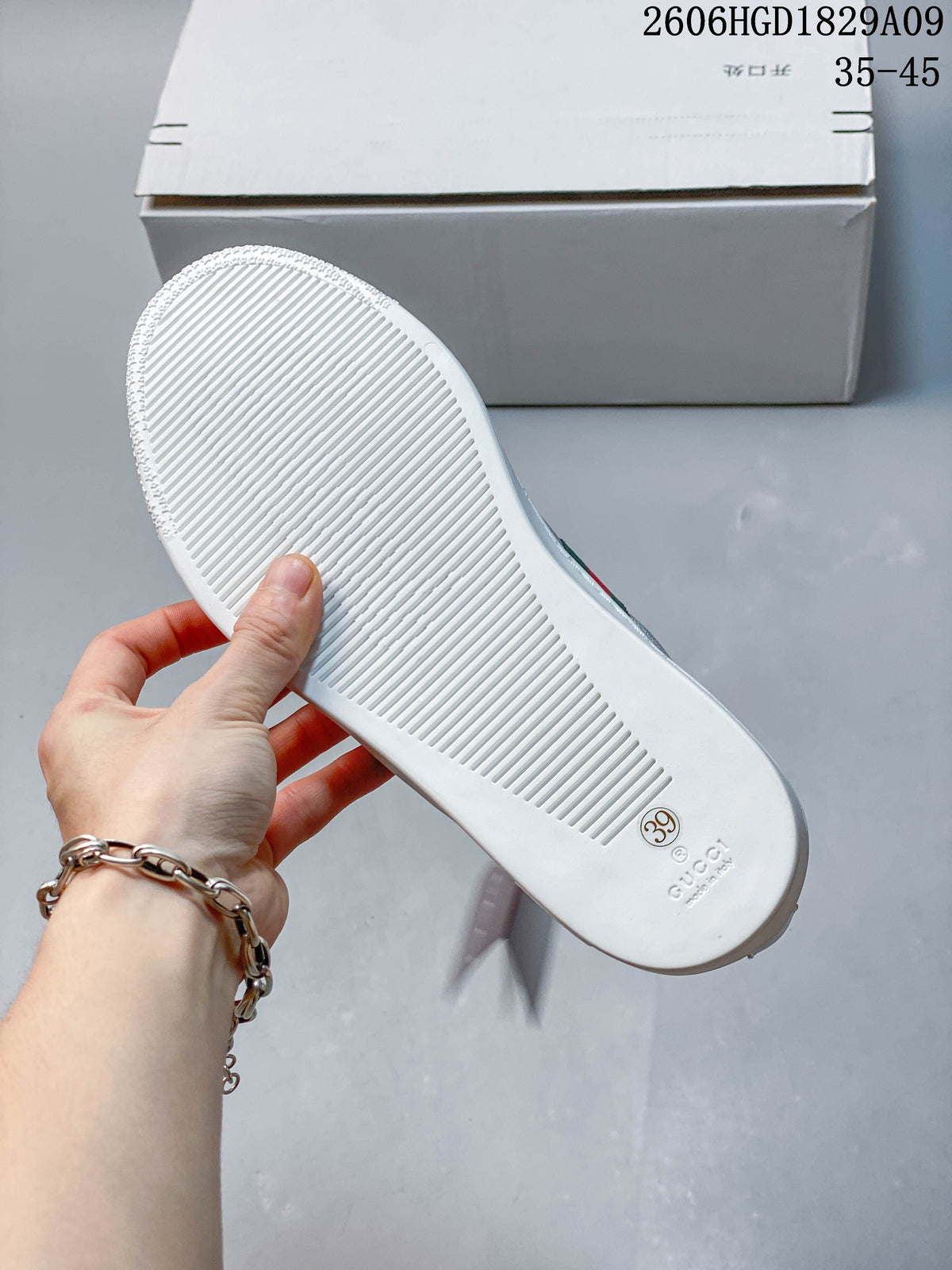 Underside of a white sneaker sole, with the shoe sample marked EU size 39.