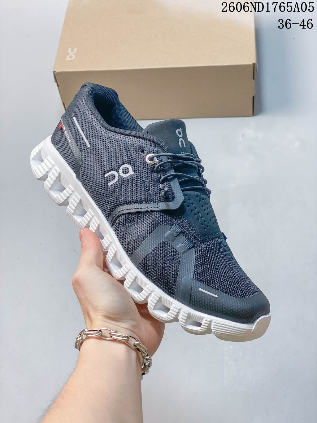 Charcoal gray On Cloud 5 sneaker shown from the side with a white outsole.