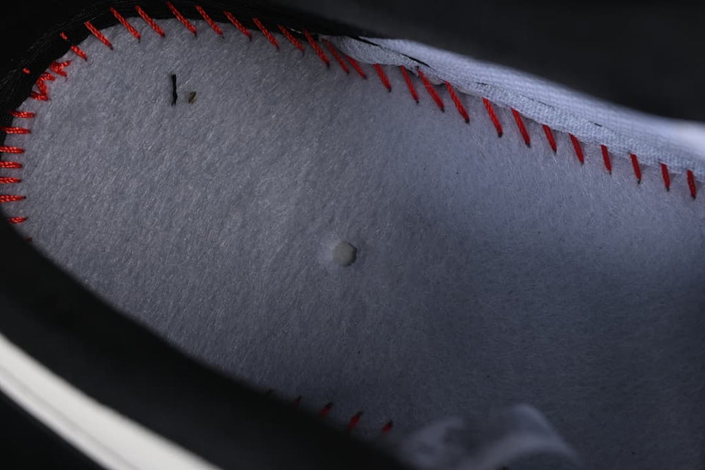 Close-up of the interior lining and red stitching