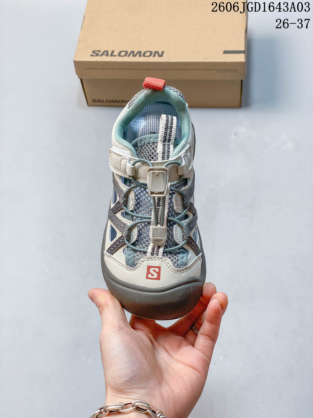 Top view of a Salomon kids’ sneaker showing the quick-lace closure and padded collar.