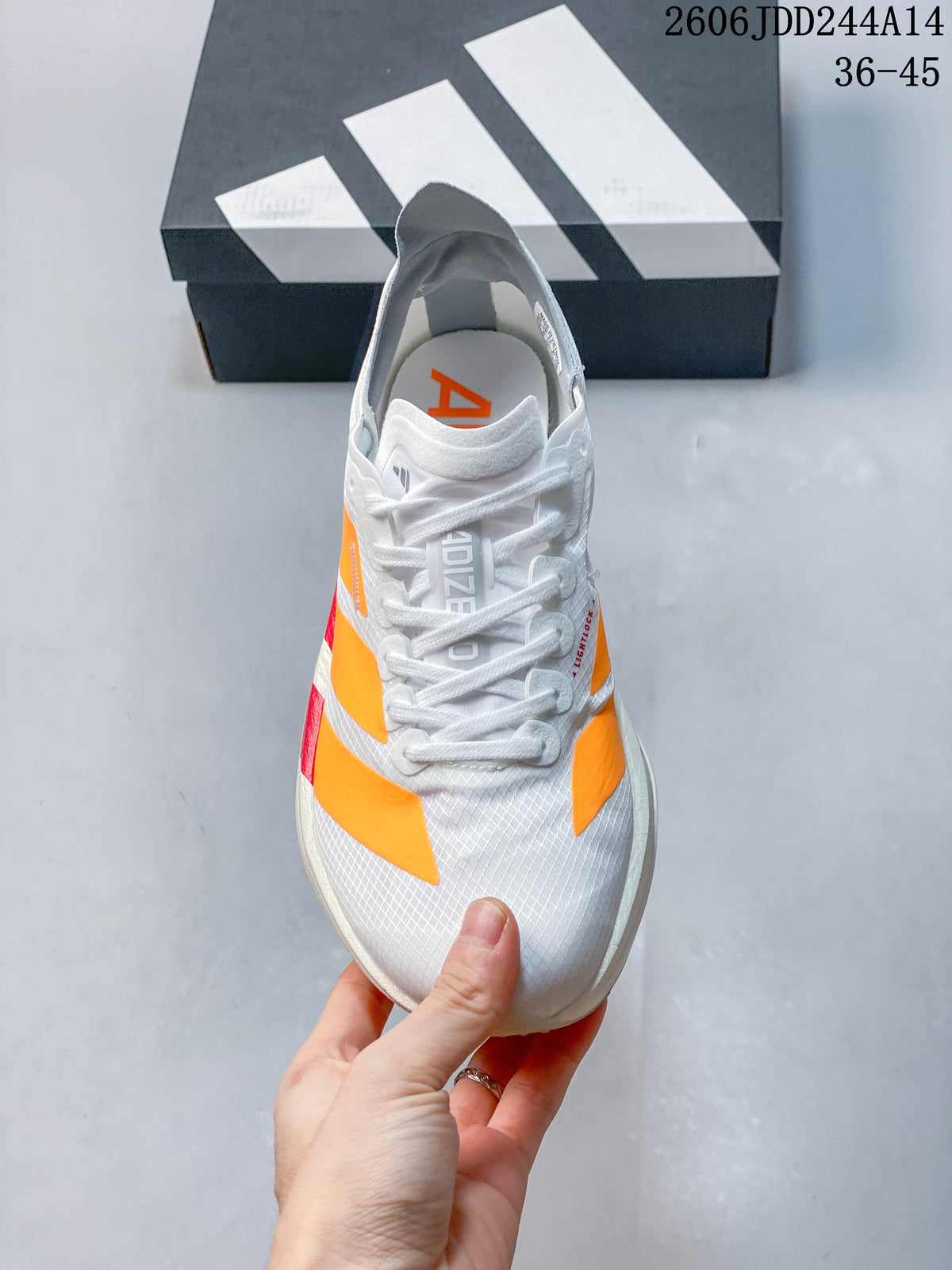 Top view of the lace-up shoe showing its white upper and orange accents; image overlay states EU sizes 36–45.