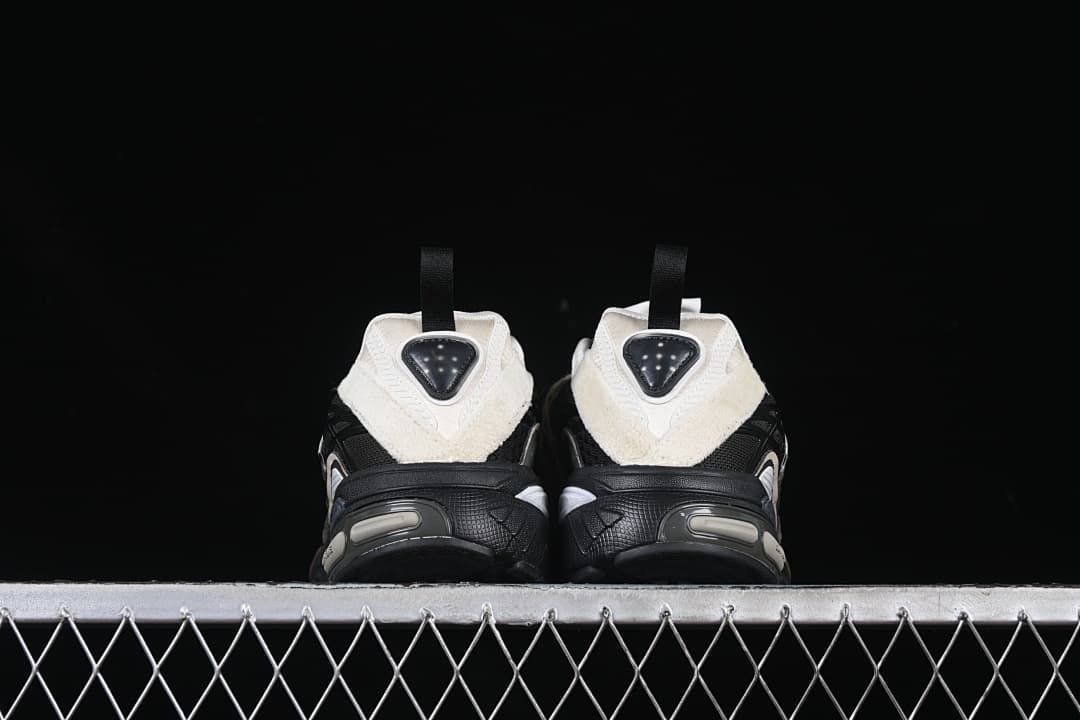 Rear view of the pair highlighting the off-white heel panels and pull tabs.